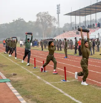 Candidates performing weight lifting during RRB Group D PET 2025 physical efficiency test on track field