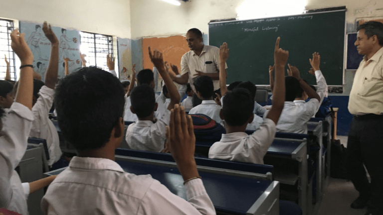 Students listening to motivational thoughts during structured morning school assembly