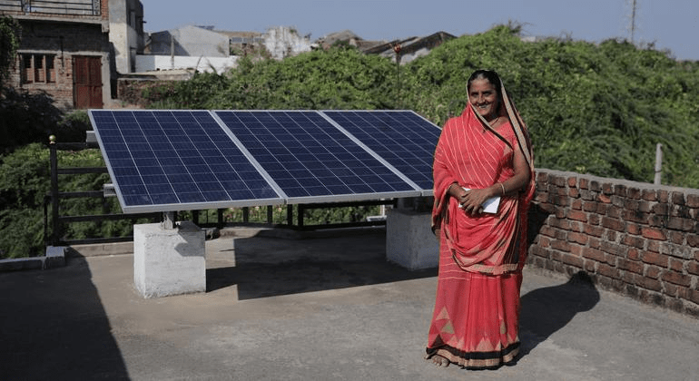 Solar panels in Indian village supporting renewable energy adoption