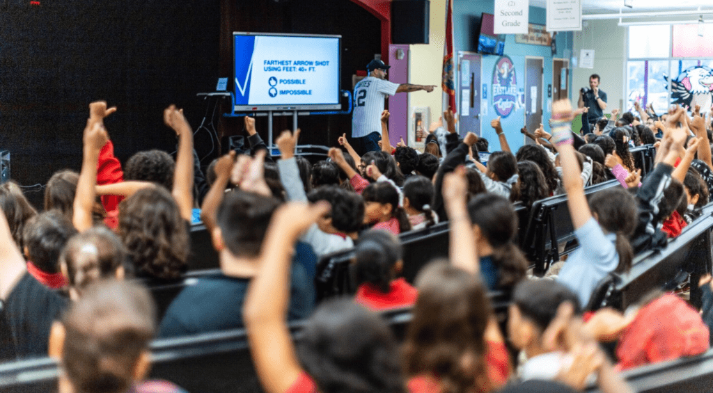 Students presenting ideas during school assembly, building confidence through English and Hindi thoughts