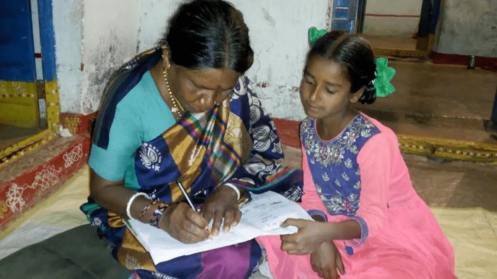 Parent helping child write a leave letter to class teacher at home