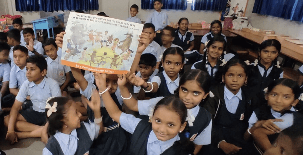 School children promoting kindness and friendship during classroom activity