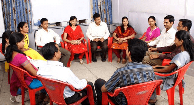 Study group discussion encouraging shared responsibility and focused learning