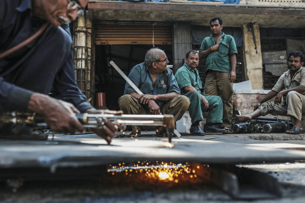 Indian worker pausing thoughtfully representing honest reality of daily effort